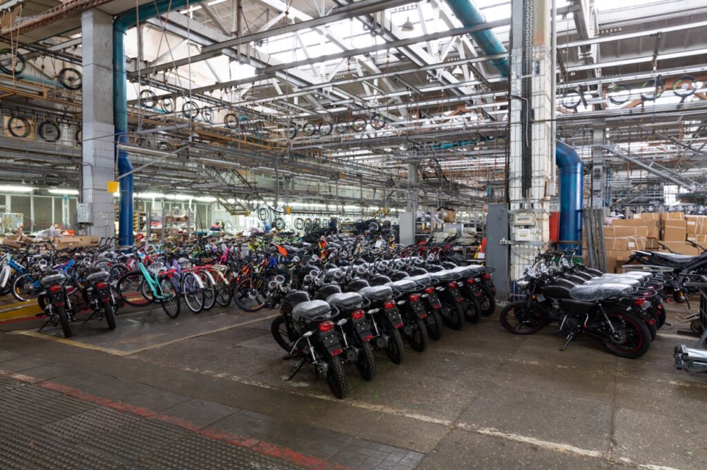 motorcycle assembly line in a modern factory, finished goods warehouse